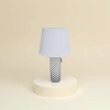 The white lampshade is paired with a black cylindrical lamp base featuring star-shaped patterns Application Scenario